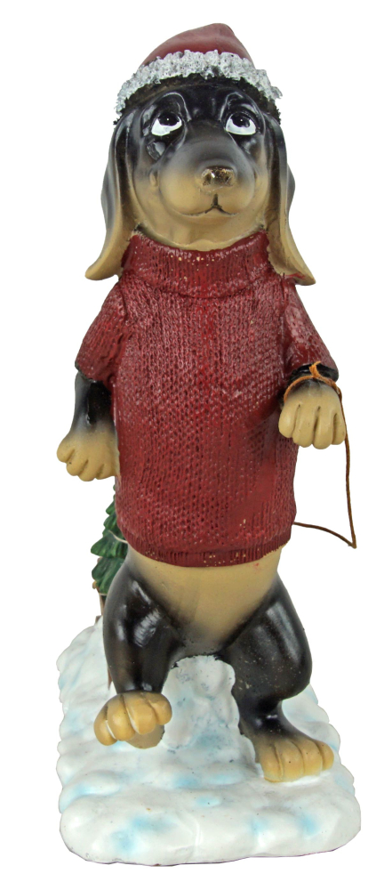 Weihnachtszauber auf vier Pfoten: Dackel mit Weihnachtsbaum-Schlitten